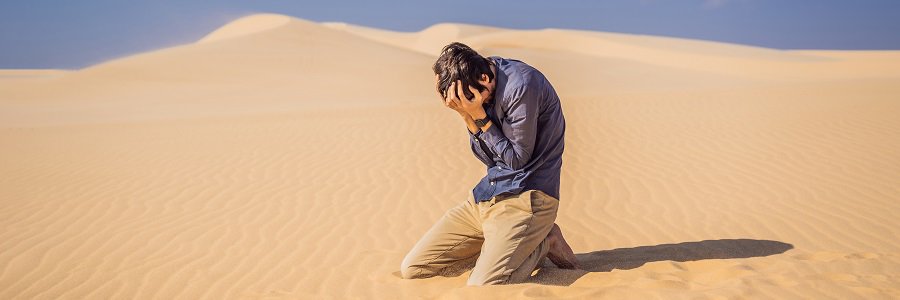 man desperate for water in the desert